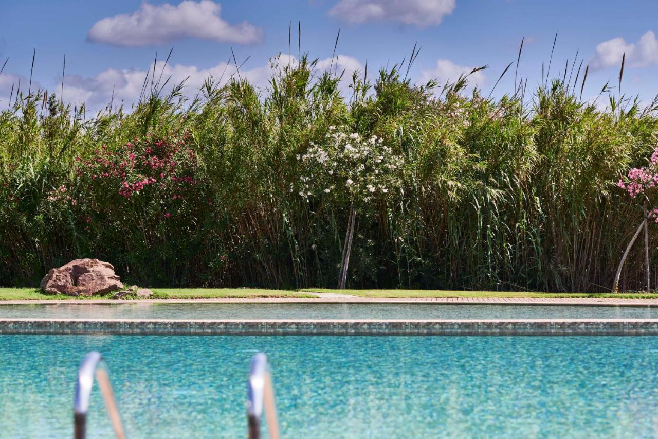 Baia Di Chia Resort Sardinia, Curio Collection By Hilton Buitenkant foto